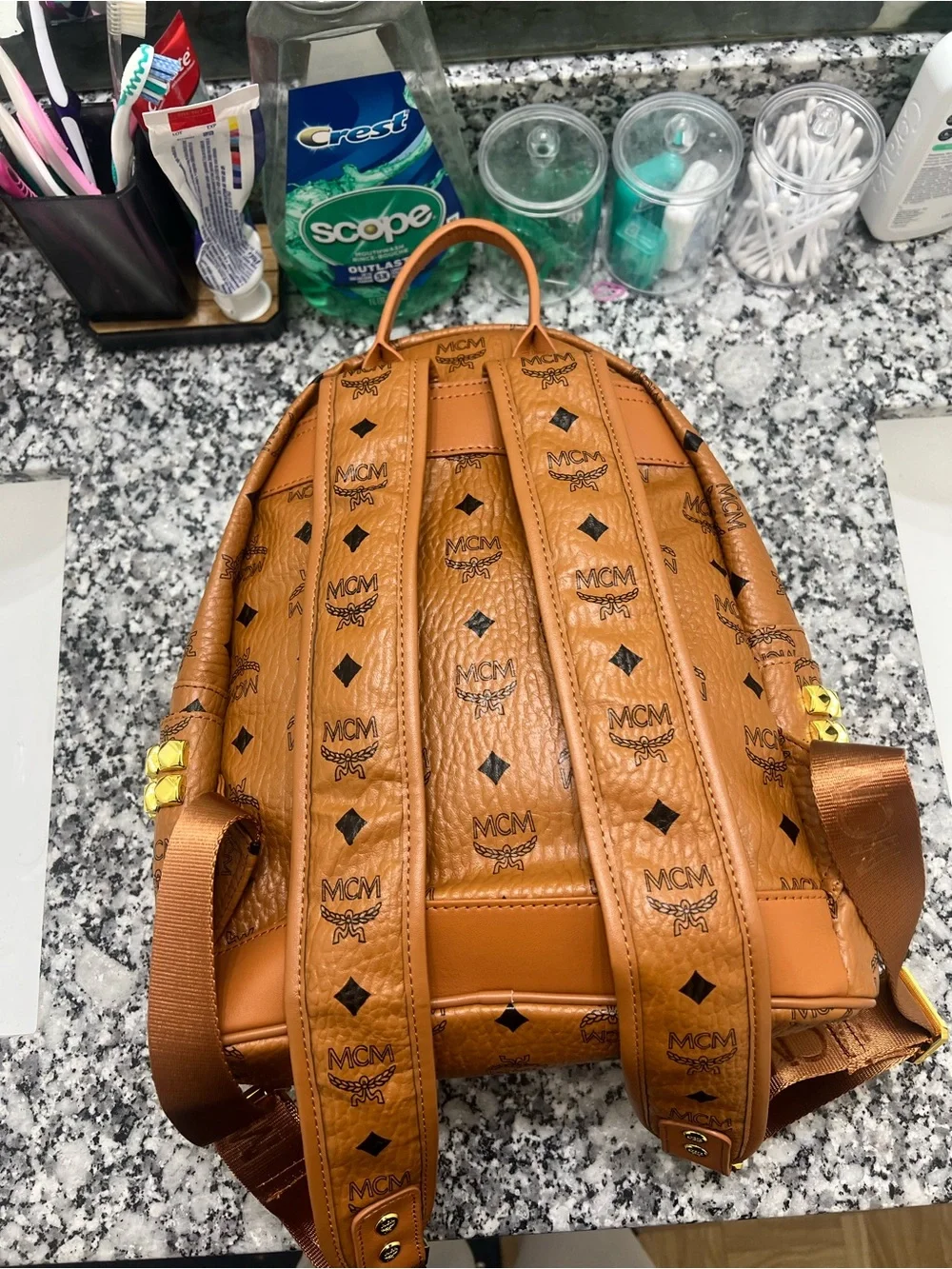 MCM Cognac Monogrammed Leather Mini Backpack with Gold Plaque